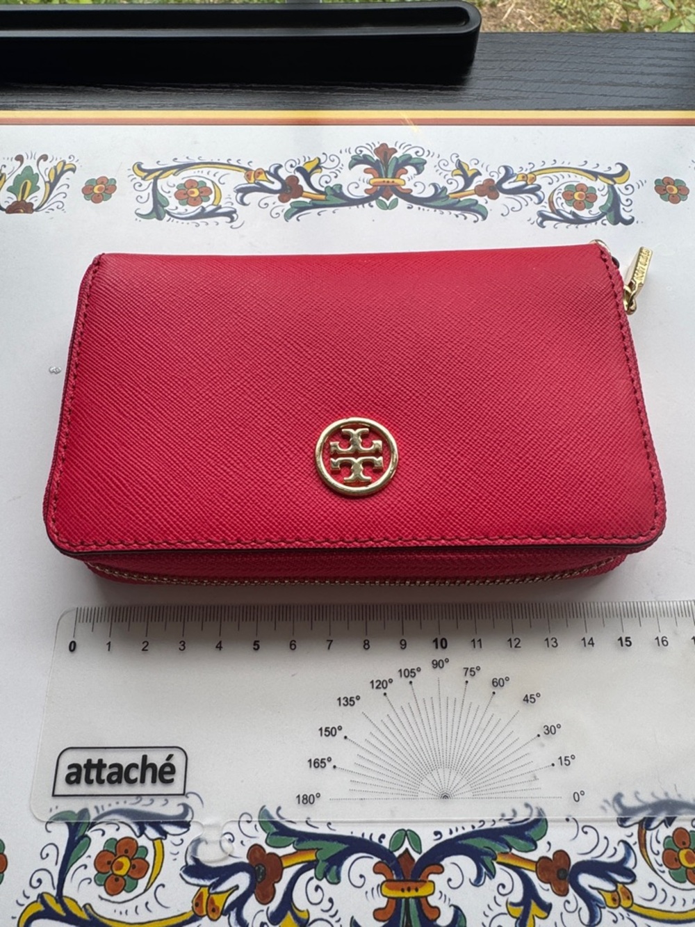 Authentic Tory Burch women’s zip wallet in vibrant red.